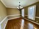 Elegant dining room with hardwood floors, chandelier, and classic trim at 1809 Waddill Way, Henderson, NC 27536