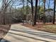 Curving driveway surrounded by mature trees on a beautiful lot at 1809 Waddill Way, Henderson, NC 27536