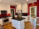 Well-lit kitchen with stainless steel appliances, black countertops and modern white cabinetry at 1809 Waddill Way, Henderson, NC 27536