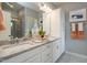 Modern bathroom featuring dual sinks, granite countertop, and a decorative mirror with vanity lighting at 2317 Bay Minette Station Sta # 545, Apex, NC 27502