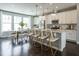 Modern kitchen with white cabinets, stainless steel appliances, granite countertops and a center island with bar stool seating at 2317 Bay Minette Station Sta # 545, Apex, NC 27502