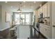 Open-concept kitchen with stainless steel appliances, marble island, and white cabinets at 2317 Bay Minette Station Sta # 545, Apex, NC 27502