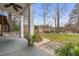 Relaxing backyard with columned porch with comfortable hanging swing and backyard view at 3104 Sandy Knoll Ln, Knightdale, NC 27545