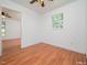 Bright bedroom with hardwood floors and a ceiling fan at 3104 Sandy Knoll Ln, Knightdale, NC 27545