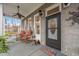 Inviting front porch with rocking chairs, decorative plants, and a 'Welcome Friends' doormat at 3104 Sandy Knoll Ln, Knightdale, NC 27545