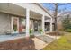 Charming front porch features stylish columns, hanging swings, and comfortable seating at 3104 Sandy Knoll Ln, Knightdale, NC 27545