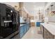 Modern kitchen with blue cabinets, stainless steel appliances, and pendant lighting at 3104 Sandy Knoll Ln, Knightdale, NC 27545