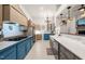 Well-lit kitchen with updated appliances, custom cabinetry, and large countertops at 3104 Sandy Knoll Ln, Knightdale, NC 27545