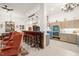 Open concept of kitchen to living room with a bar and comfortable chairs at 3104 Sandy Knoll Ln, Knightdale, NC 27545
