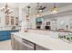 Bright, open kitchen with a farmhouse sink, stainless steel appliances, and a view into the living room at 3104 Sandy Knoll Ln, Knightdale, NC 27545