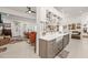 Open-concept kitchen with a farmhouse sink and view into the living room at 3104 Sandy Knoll Ln, Knightdale, NC 27545