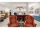 Bright, open floor plan with a kitchen in the background and comfortable seating in the foreground at 3104 Sandy Knoll Ln, Knightdale, NC 27545