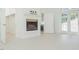 Bright living room features a fireplace, access to an outdoor area, and storage at 3104 Sandy Knoll Ln, Knightdale, NC 27545