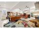 Spacious living room with modern decor, open concept design, and seamless transition to the kitchen at 3104 Sandy Knoll Ln, Knightdale, NC 27545