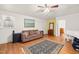 Comfortable living room with neutral tones, a decorative rug, and ample natural light at 3104 Sandy Knoll Ln, Knightdale, NC 27545
