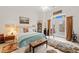 Comfortable bedroom features carpet flooring, bright light and patio access at 3104 Sandy Knoll Ln, Knightdale, NC 27545