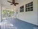 Inviting screened porch with painted wood floors, offering a relaxing and bug-free outdoor space at 3104 Sandy Knoll Ln, Knightdale, NC 27545