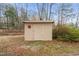 Outbuilding with beige siding and a door at 3104 Sandy Knoll Ln, Knightdale, NC 27545