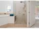 Bathroom features a walk-in shower with glass door adjacent to the soaking tub at 3104 Sandy Knoll Ln, Knightdale, NC 27545