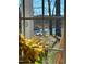 View of a waterway and bridge through a multi-pane window with plant in the foreground at 3104 Sandy Knoll Ln, Knightdale, NC 27545