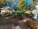 Spacious backyard featuring a garden area, cottage, and extra building at 3104 Sandy Knoll Ln, Knightdale, NC 27545