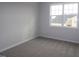 Cozy bedroom with plush carpet, a large window offering natural light and neighborhood views at 3195 Mission Olive Pl # 352, New Hill, NC 27562
