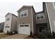 New construction townhome with attached garage, neutral siding and nicely landscaped front at 3195 Mission Olive Pl # 352, New Hill, NC 27562