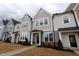 Charming townhomes with Craftsman-style architecture and inviting front entrances and drought resistant landscaping at 3195 Mission Olive Pl # 352, New Hill, NC 27562