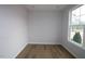Bright room with hardwood floors and a large window offering natural light and neighborhood views at 3195 Mission Olive Pl # 352, New Hill, NC 27562