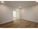 Spacious room with hardwood floors and sliding glass door, great for an office or entertainment space at 3195 Mission Olive Pl # 352, New Hill, NC 27562