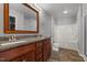Bathroom featuring a double sink vanity, and tub at 35 Henry Rifle Ln, Angier, NC 27501
