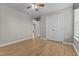 Bedroom featuring hardwood floors, neutral walls, double door closet and ample natural light at 35 Henry Rifle Ln, Angier, NC 27501