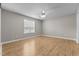 Light and airy bedroom with hardwood floors, a ceiling fan, and a large window at 35 Henry Rifle Ln, Angier, NC 27501