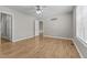 Bright bedroom featuring hardwood floors, neutral walls, and a modern ceiling fan with lighting at 35 Henry Rifle Ln, Angier, NC 27501