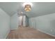 Bonus room with two doors and a pendant light at 35 Henry Rifle Ln, Angier, NC 27501