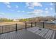 Spacious deck overlooking a large backyard with lush greenery and a privacy fence at 35 Henry Rifle Ln, Angier, NC 27501