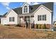 Charming one-story home with a manicured lawn and inviting front porch at 35 Henry Rifle Ln, Angier, NC 27501