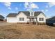 Charming one-story home with a manicured lawn and inviting front porch at 35 Henry Rifle Ln, Angier, NC 27501