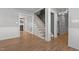 Inviting entryway with wood-look floors leading to stairs, barn door, and other rooms at 35 Henry Rifle Ln, Angier, NC 27501