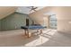 Open game room featuring a pool table, recessed lighting, and arched window at 35 Henry Rifle Ln, Angier, NC 27501
