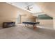 Spacious game room with pool table, fireplace, and ample lighting at 35 Henry Rifle Ln, Angier, NC 27501