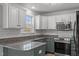 Updated kitchen featuring granite countertops, stainless steel appliances, and subway tile backsplash at 35 Henry Rifle Ln, Angier, NC 27501
