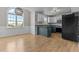 Eat-in kitchen with modern appliances, granite countertops, a neutral backsplash, and lots of natural light at 35 Henry Rifle Ln, Angier, NC 27501