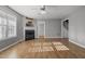 Living room showcasing a fireplace and neutral walls, complemented by wood-look flooring and natural light at 35 Henry Rifle Ln, Angier, NC 27501