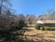 A house with a spacious backyard, surrounded by lush trees at 3501 Turnbridge Dr, Raleigh, NC 27609