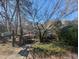 A home with a welcoming front yard, a charming walkway, and mature trees at 3501 Turnbridge Dr, Raleigh, NC 27609