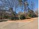 A neighborhood street view with mature trees at 3501 Turnbridge Dr, Raleigh, NC 27609