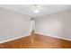 Bedroom features parquet floors, neutral walls, and a ceiling fan at 3716 Yorktown Pl, Raleigh, NC 27609