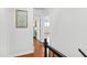 Hallway with a view into a bedroom with neutral paint and bright natural light from a window at 3716 Yorktown Pl, Raleigh, NC 27609