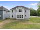 View of a spacious backyard with newly laid sod and a modern home exterior at 376 Buckhorn Branch Park # 38, Clayton, NC 27520